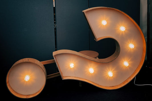 Lit question mark sign yellow