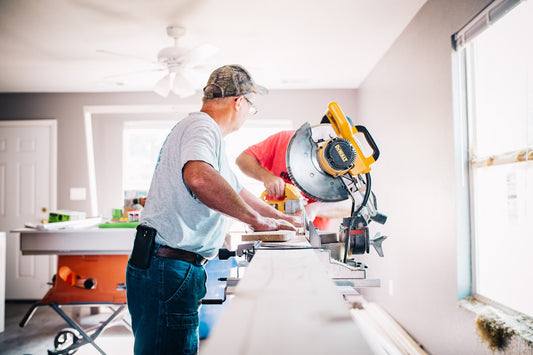 Photo of two workers at home remodel site