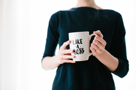 Photo of woman holding a mug Like a Boss