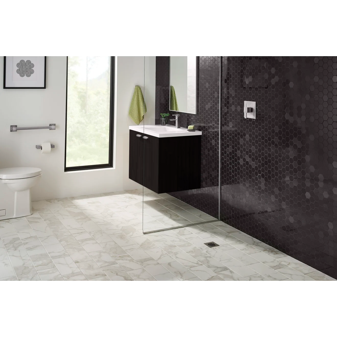 Black hexagon mosaic tile lining the shower and vanity wall with off-white, veined, marble floor.