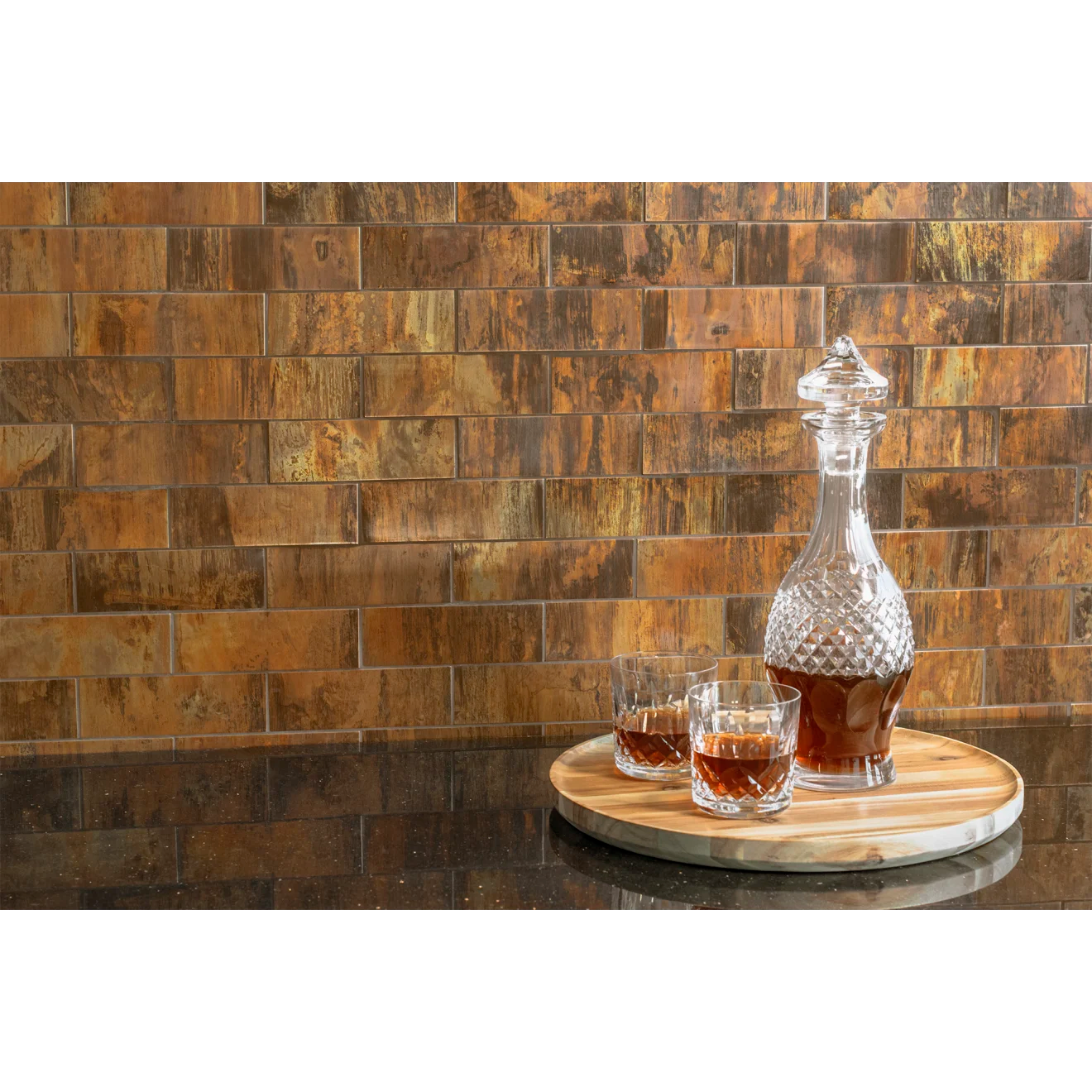 Polished granite countertop with orange and brown backsplash