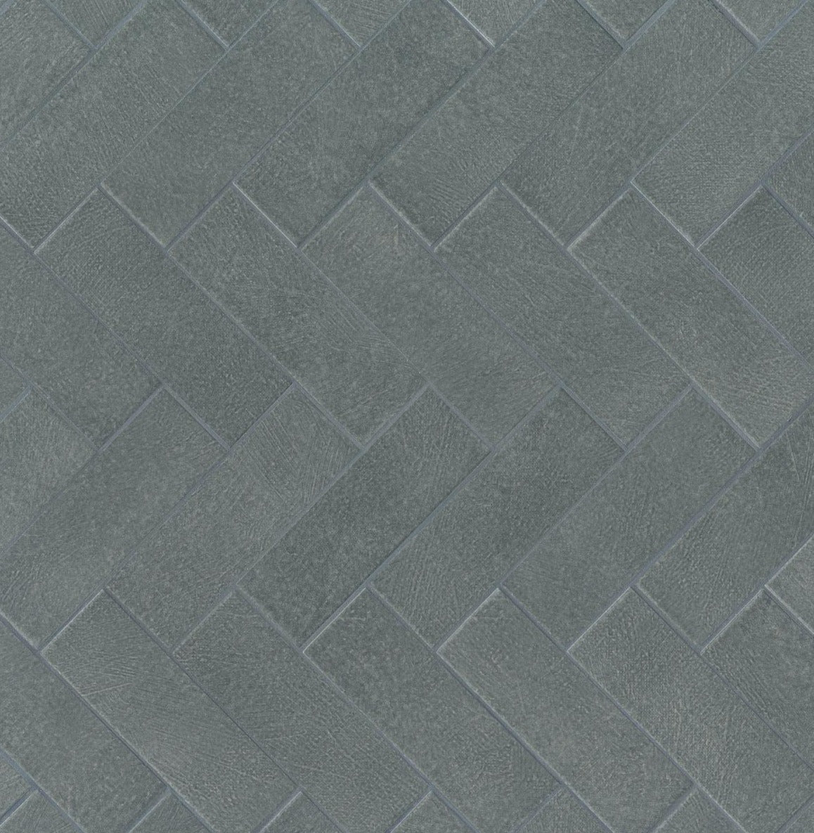 2.5" x 8" Wall tile in color Oleasto in a repeated herringbone pattern.