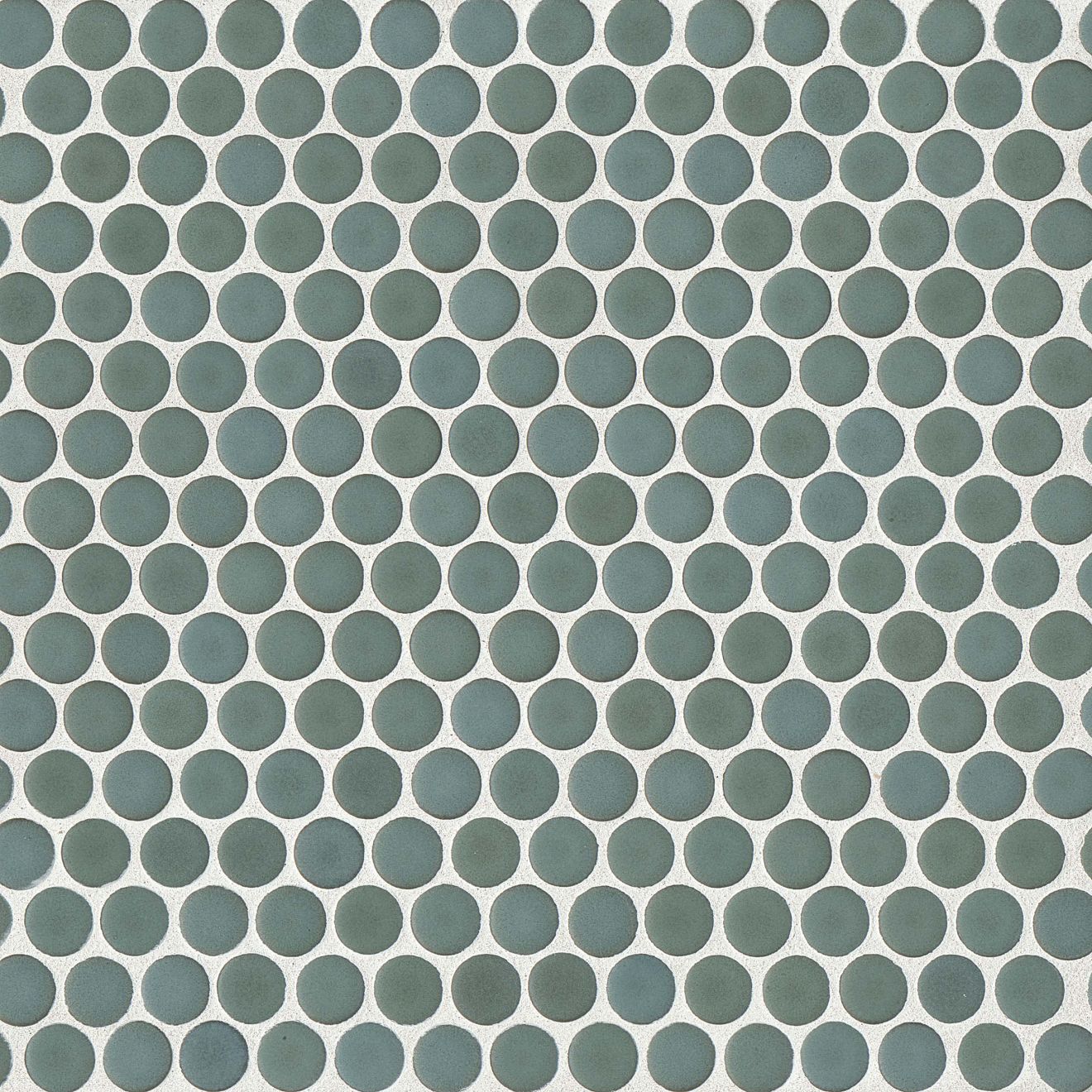 Silver sage green penny shaped mosaic tile on a beige background.