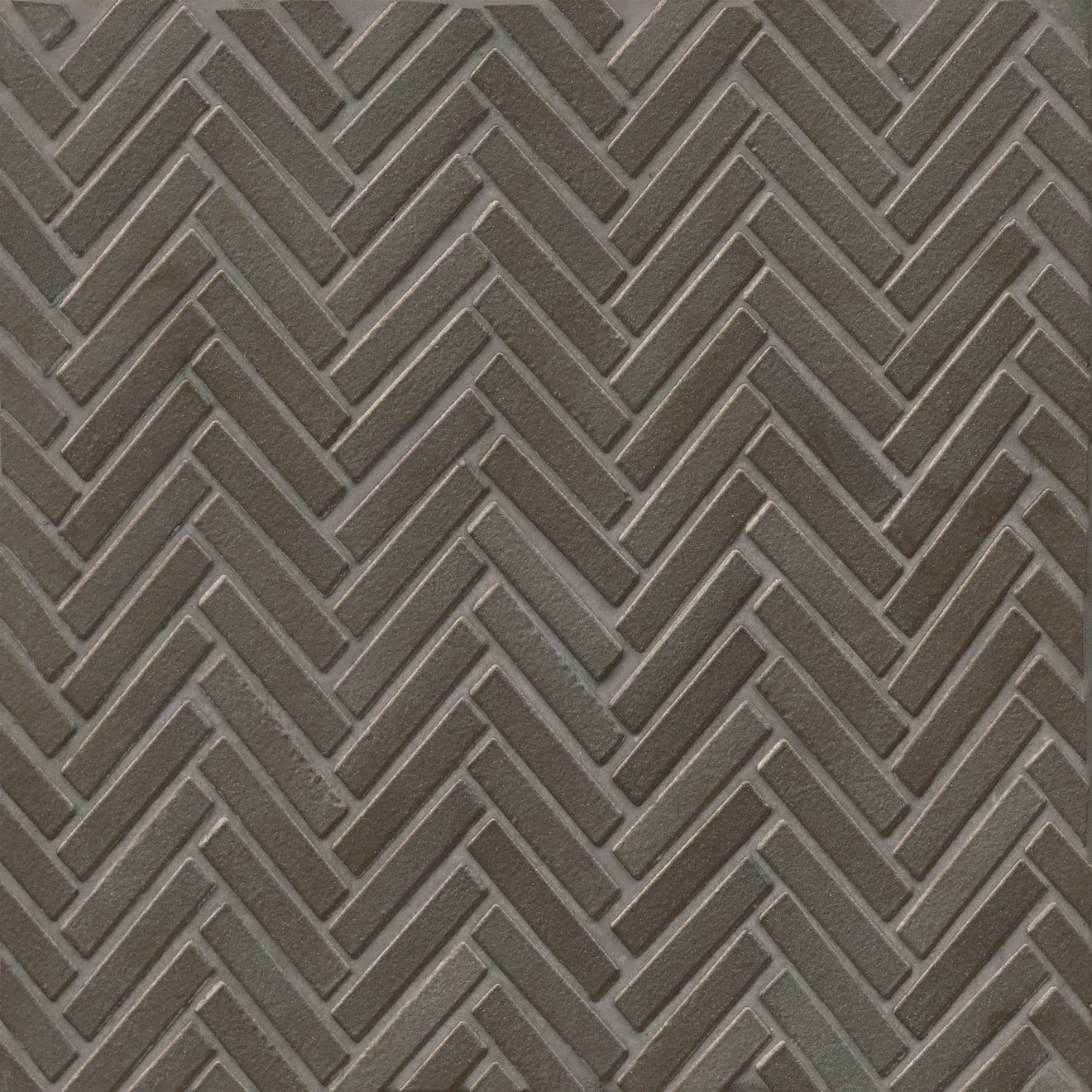 Herringbone tile in the color Metallic on a neutral background.