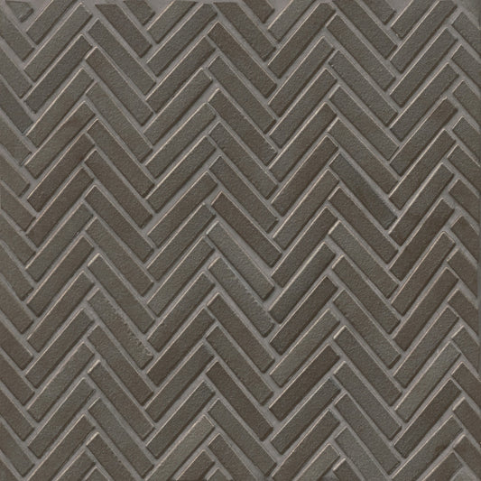 Herringbone tile in the color Metallic on a neutral background.