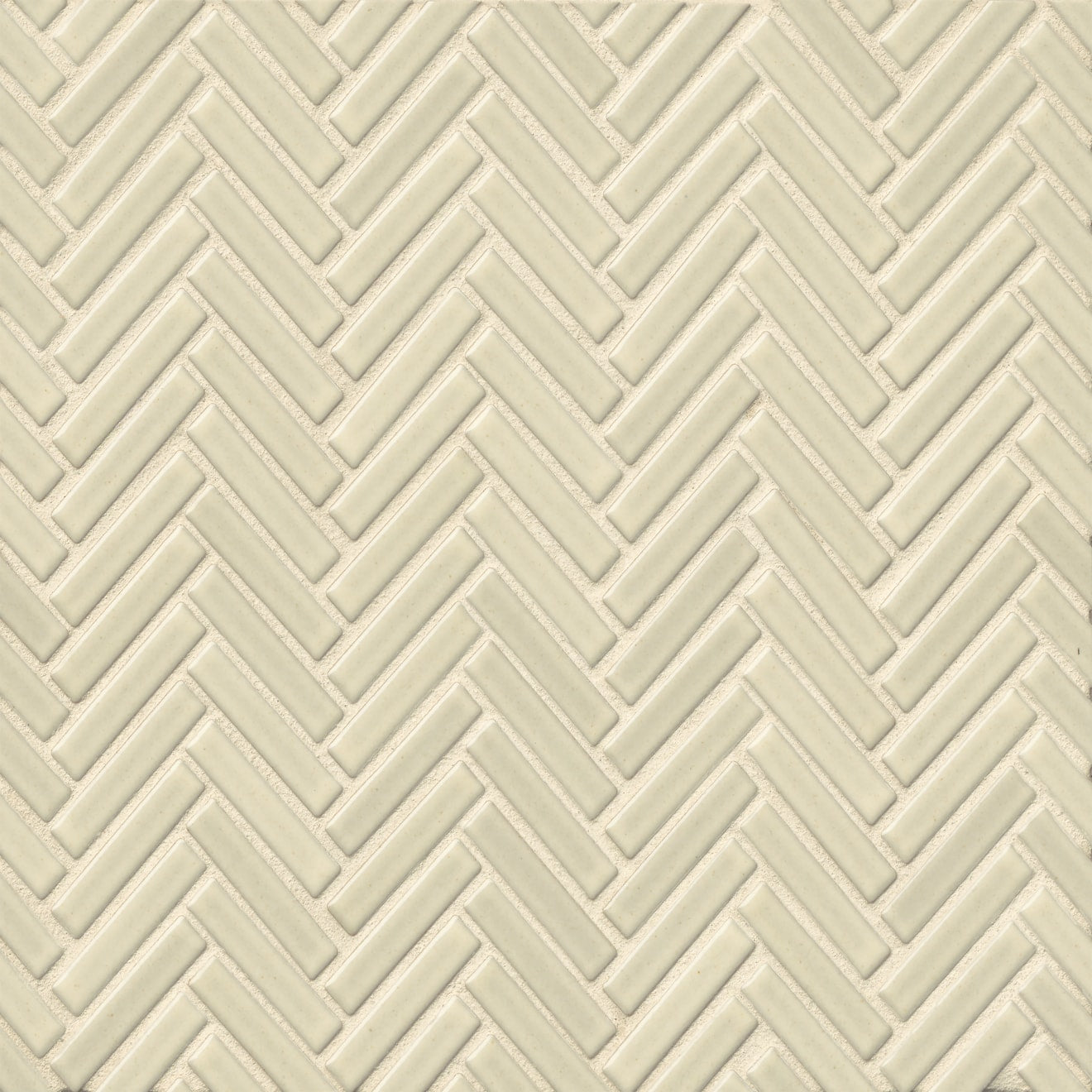 Herringbone tile in the color Off White on a neutral background.