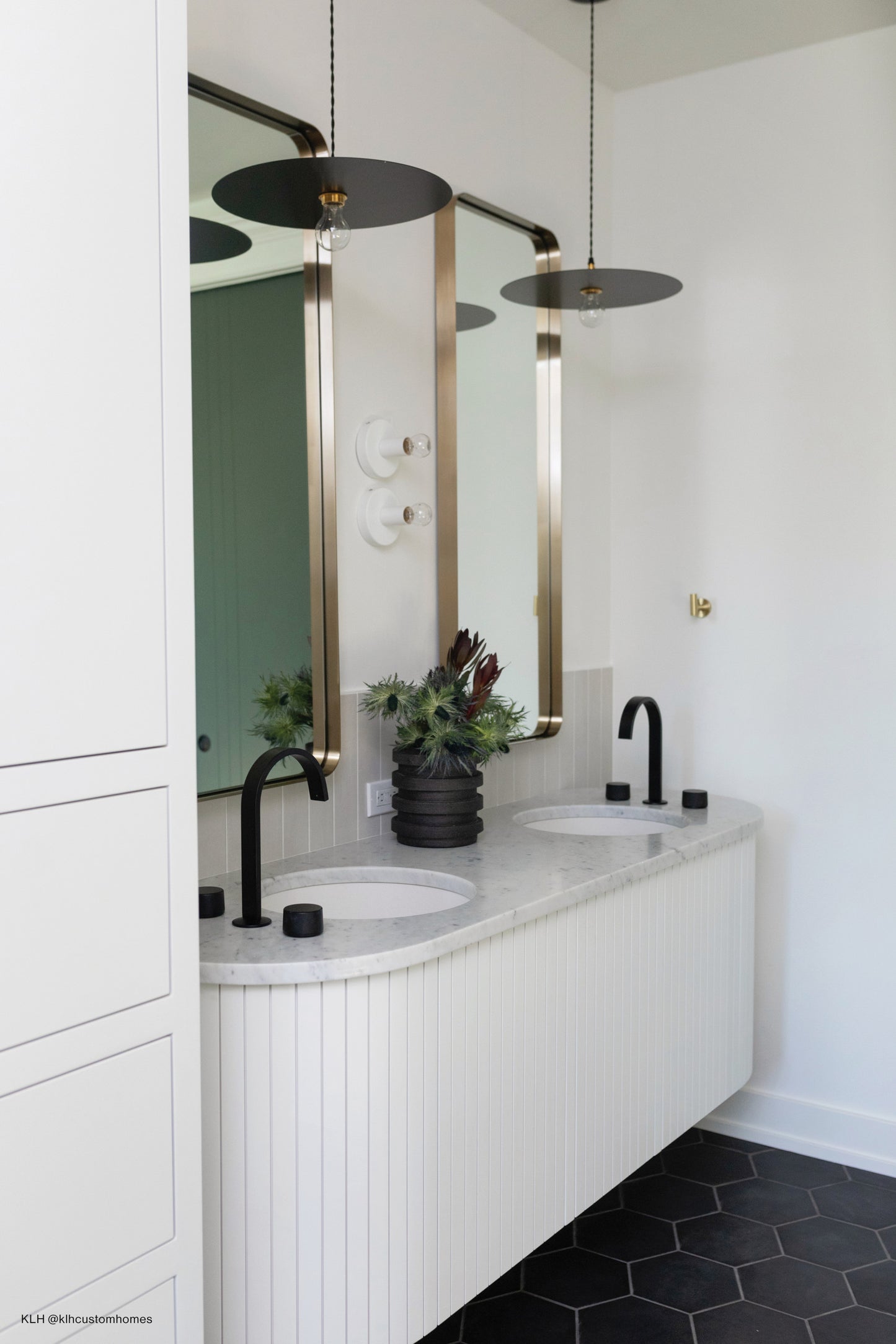 Grey vertical field tile used as backsplash behind bathroom vanity