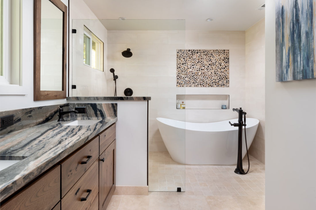 Remodeled Master Bathroom by Jackie Lopey of Wide Canvas with Custom Wirebrushed Knotty Alder Cabinets, Wetroom, Freestanding Tub, Freestanding Tub Filler, Pebble Tile Inset, Black Plumbing Fixtures
