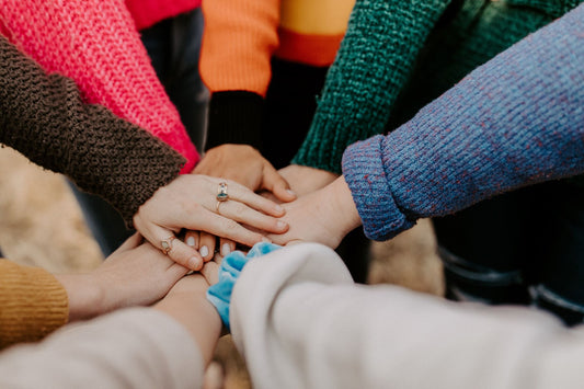 Outstretched Hands Coming Together