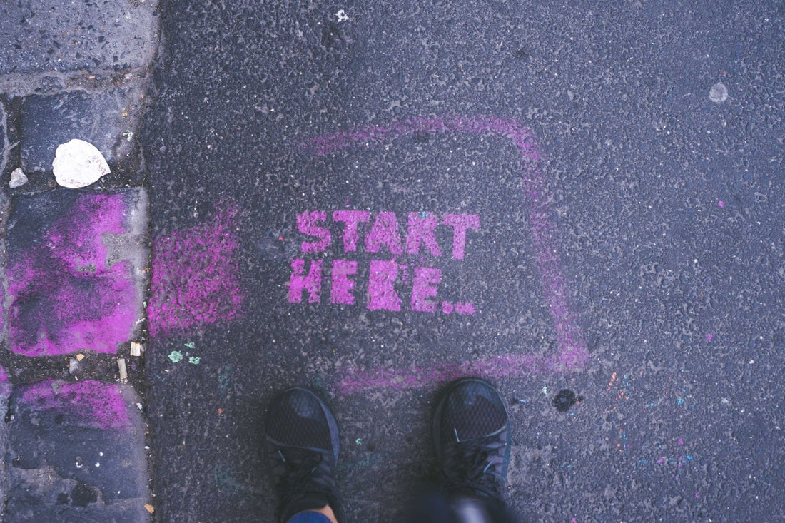 Start Here in Chalk on Sidewalk