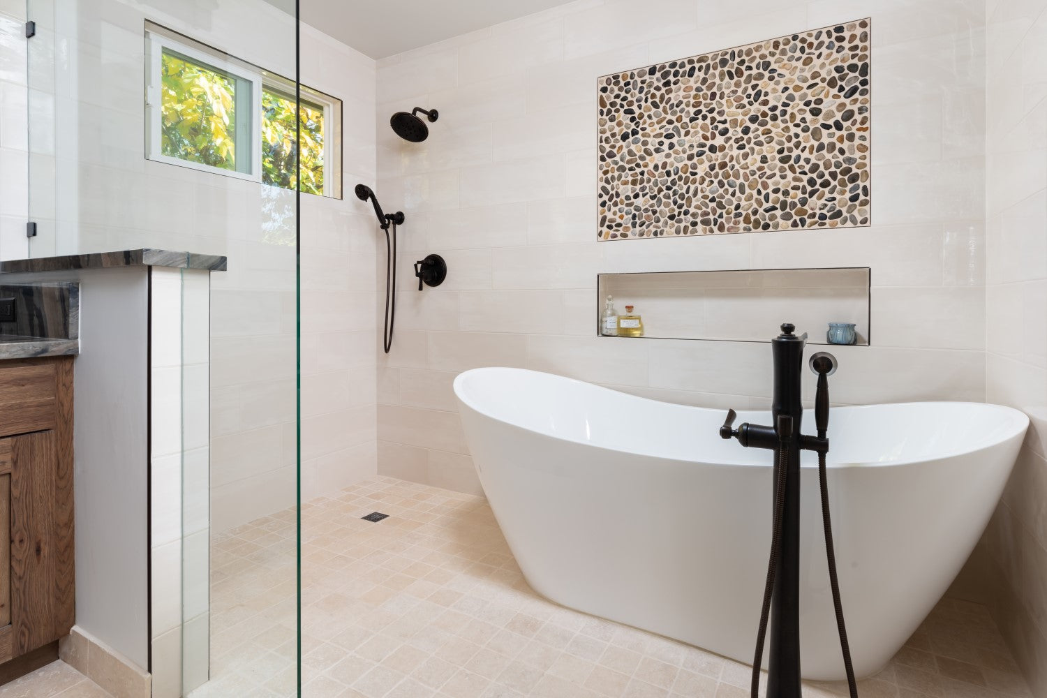 Modern bathroom with a freestanding bathtub and shower area.