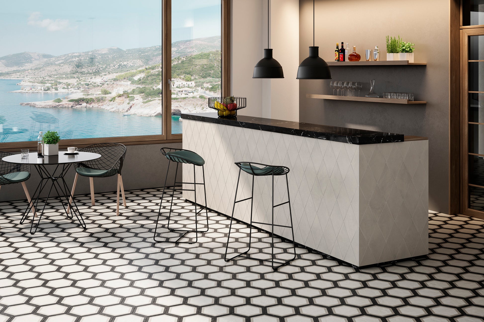 Restaurant overlooking ocean few with bar to the right and a table and two chairs to the left. The floor is the decorative hexagon field tile in the style of Teliano.