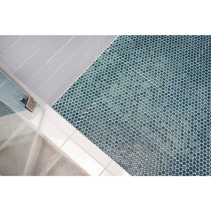 Shale Green penny round tile lining shower floor.