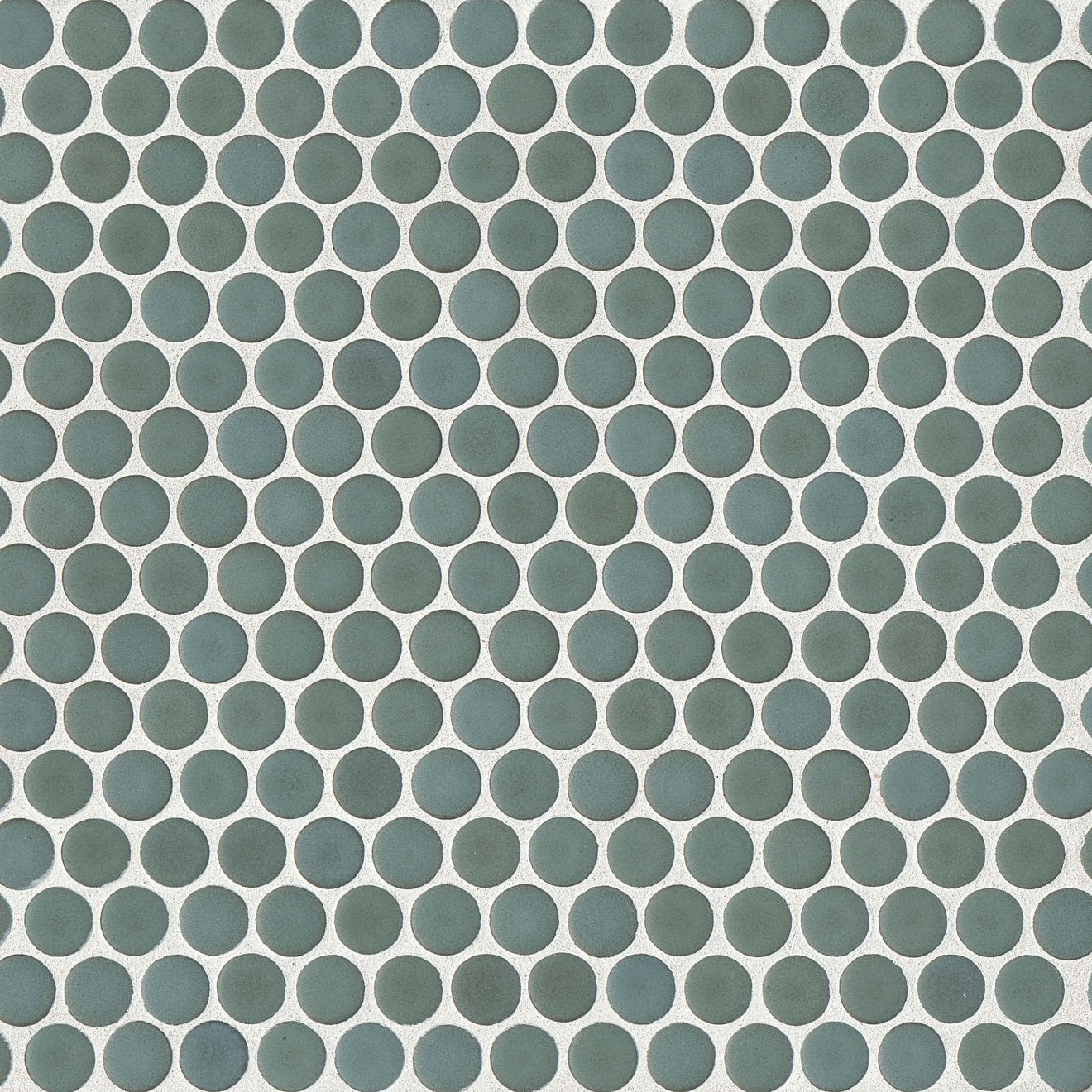 Silver sage green penny shaped mosaic tile on a beige background.
