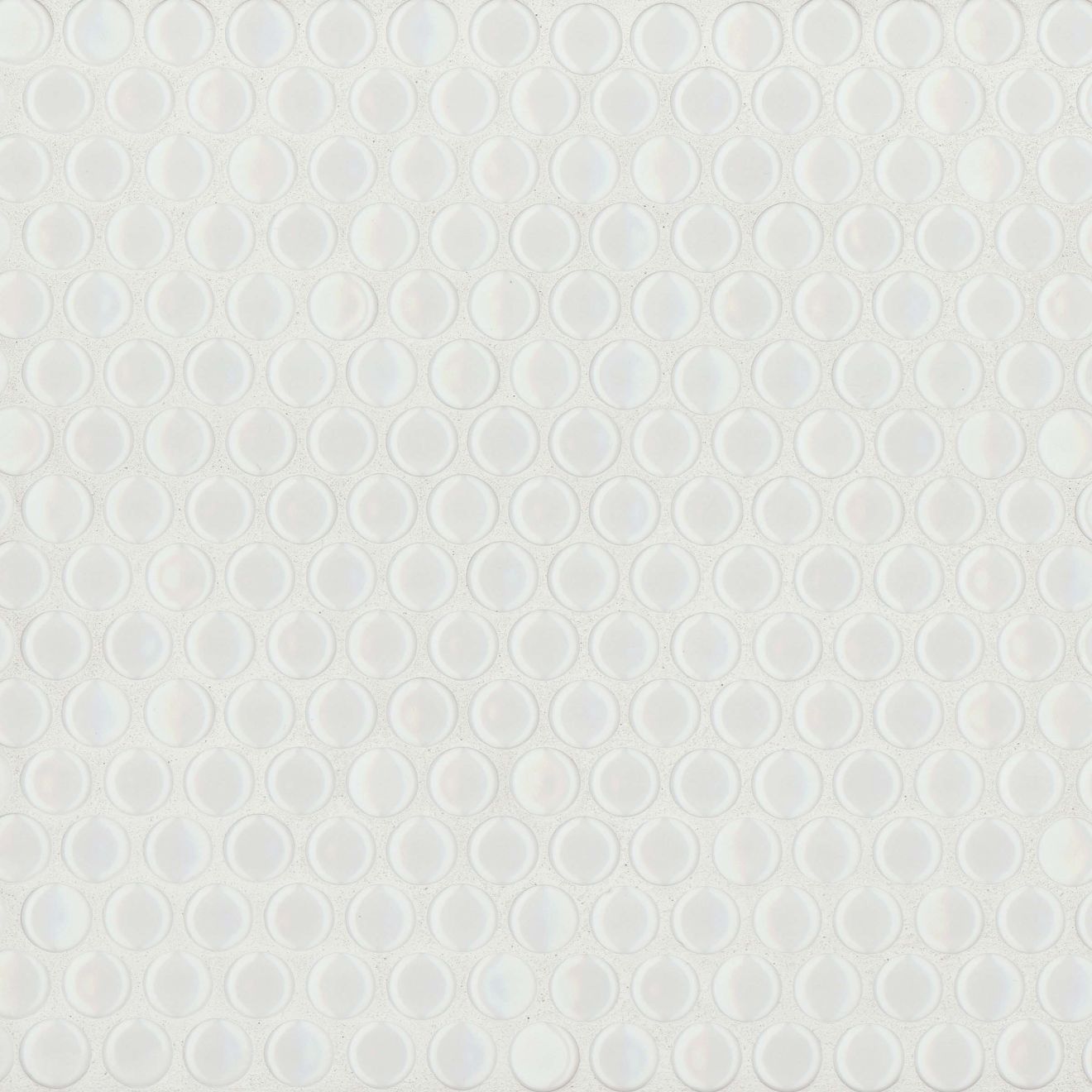 White gloss penny shaped mosaic tile on a beige background.