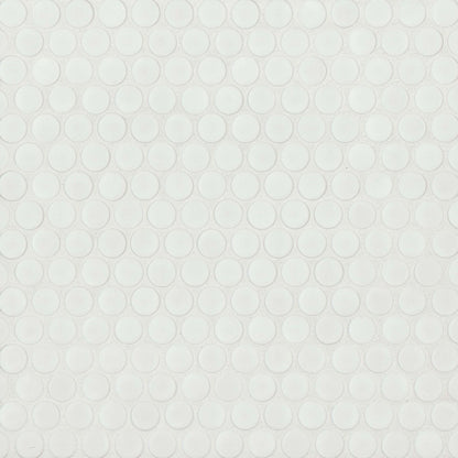 Matte white penny shaped mosaic tile on a beige background.