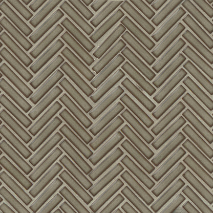 Herringbone tile in the color Grey Haze on a neutral background. 