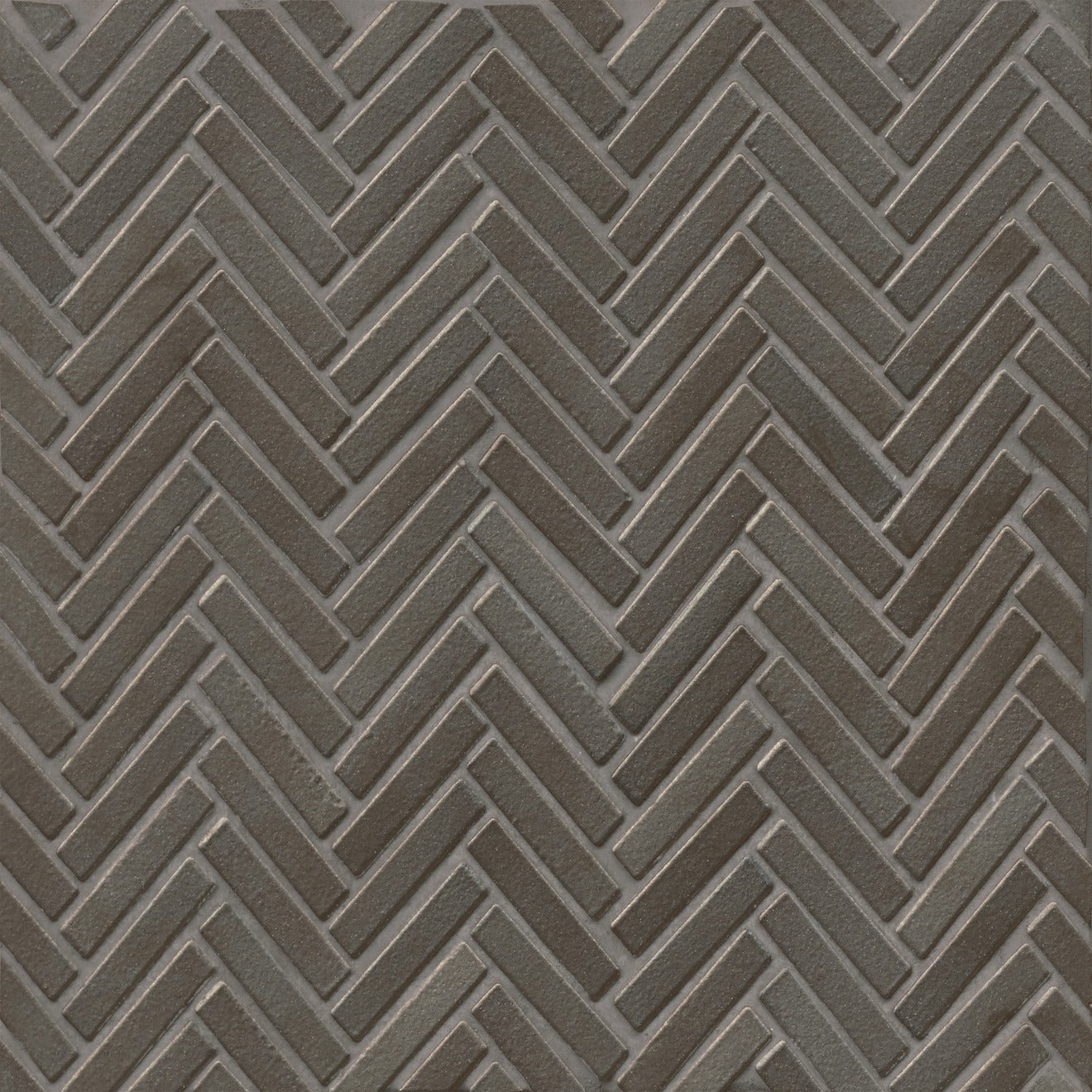 Herringbone tile in the color Metallic on a neutral background. 