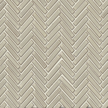 Herringbone tile in the color Putty on a neutral background. 