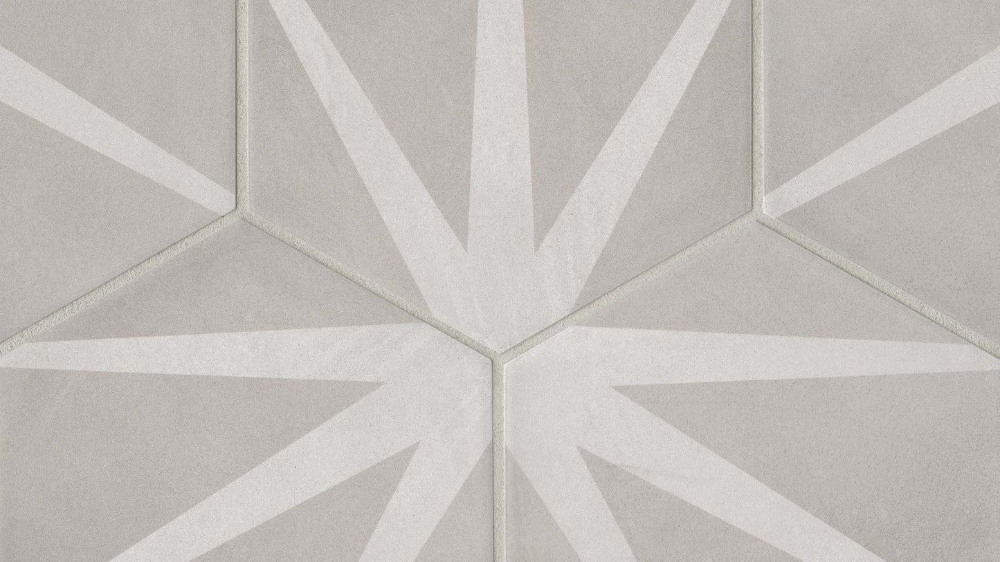 Grey hexagon tile with white points that extend past the edges. The points come together to create a star pattern when placed next to similar tile.